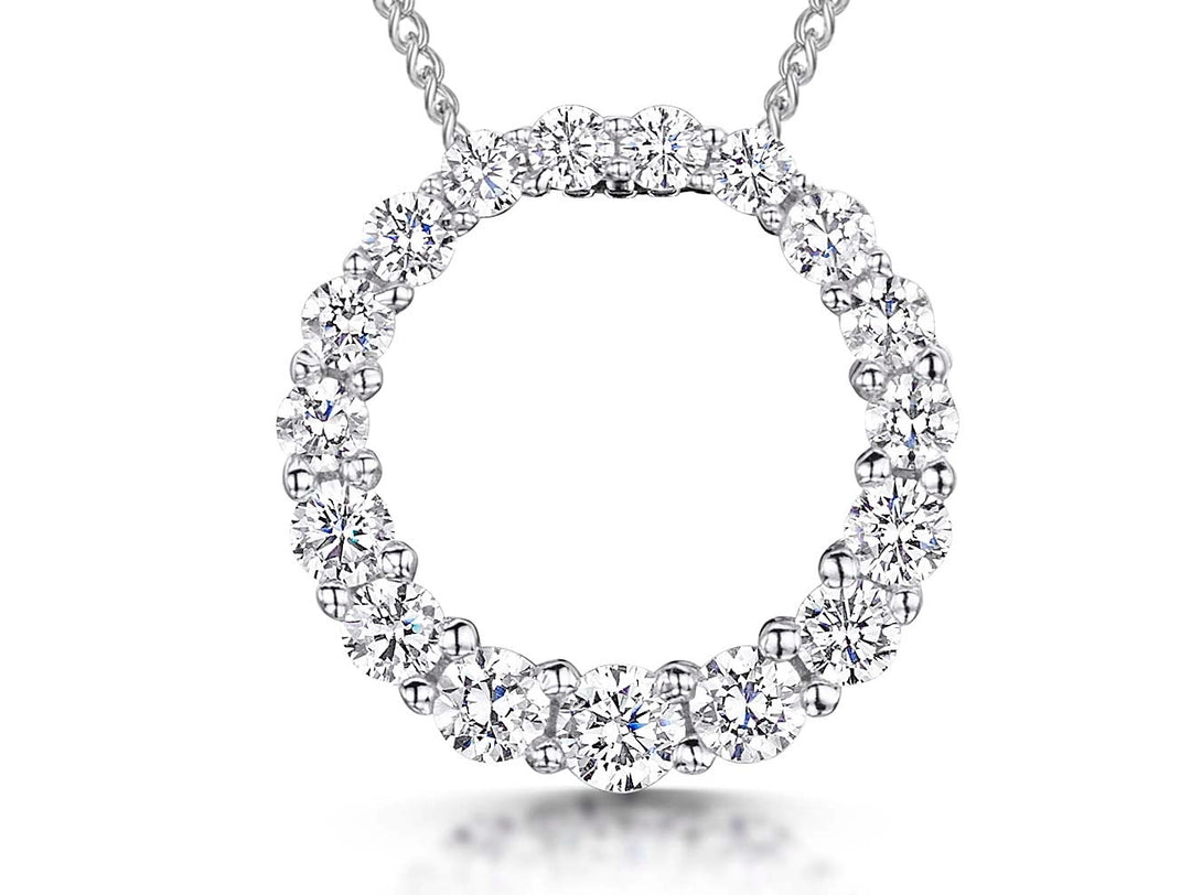 A sterling silver open circle pendant encrusted with white brilliant cut cubic zirconia stones, displayed on a chain.-JOOLS by Jenny Brown