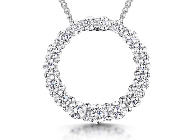 A sterling silver open circle pendant encrusted with white brilliant cut cubic zirconia stones, displayed on a chain.-JOOLS by Jenny Brown