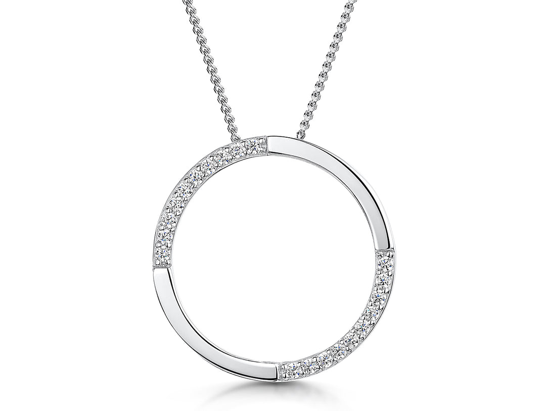 A sterling silver open circle pendant with cubic zirconia stones set in a semi-polished finish, attached to a silver chain.-JOOLS by Jenny Brown