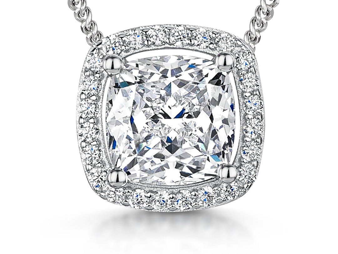 A sterling silver cushion cut halo cubic zirconia pendant with a 3 carat equivalent, featuring a surrounding stones and an adjustable chain-JOOLS by Jenny Brown