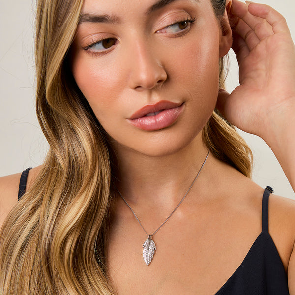 A sterling silver feather pendant set with cubic zirconias-JOOLS by Jenny Brown