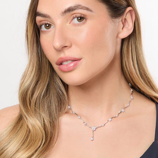 A sterling silver necklace with a floral drop design and cubic zirconia stones, rhodium finished-JOOLS by Jenny Brown