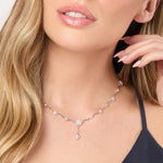 Load image into Gallery viewer, A sterling silver necklace with a floral drop design and cubic zirconia stones, rhodium finished-JOOLS by Jenny Brown
