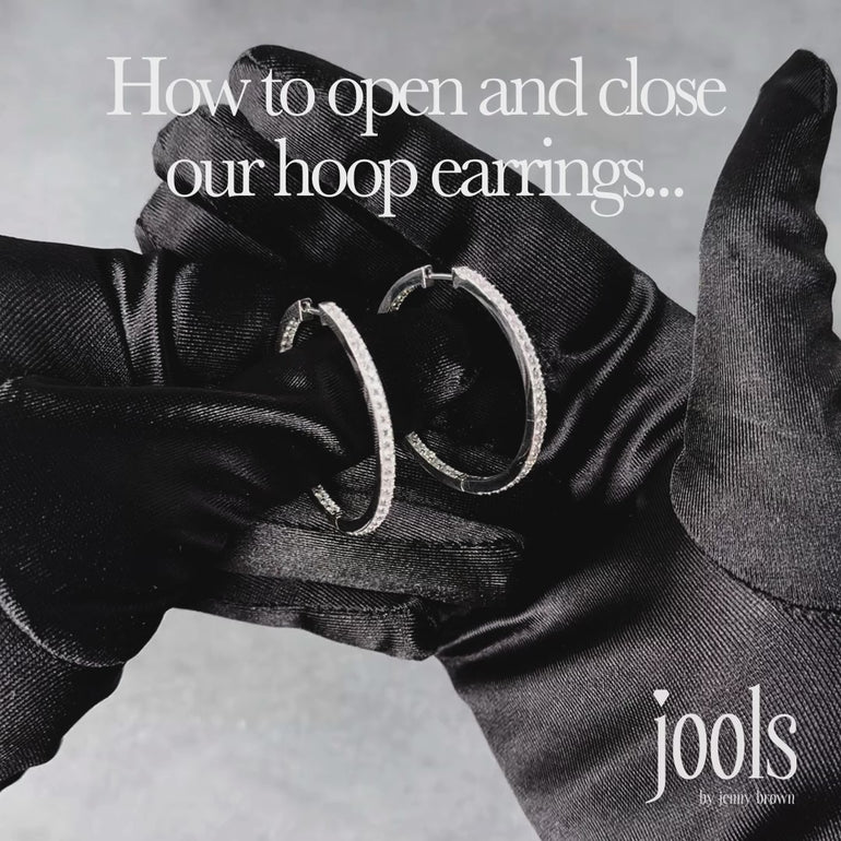 A pair of medium-sized  sterling silver hoop earrings set with cubic zirconia's-JOOLS by Jenny Brown