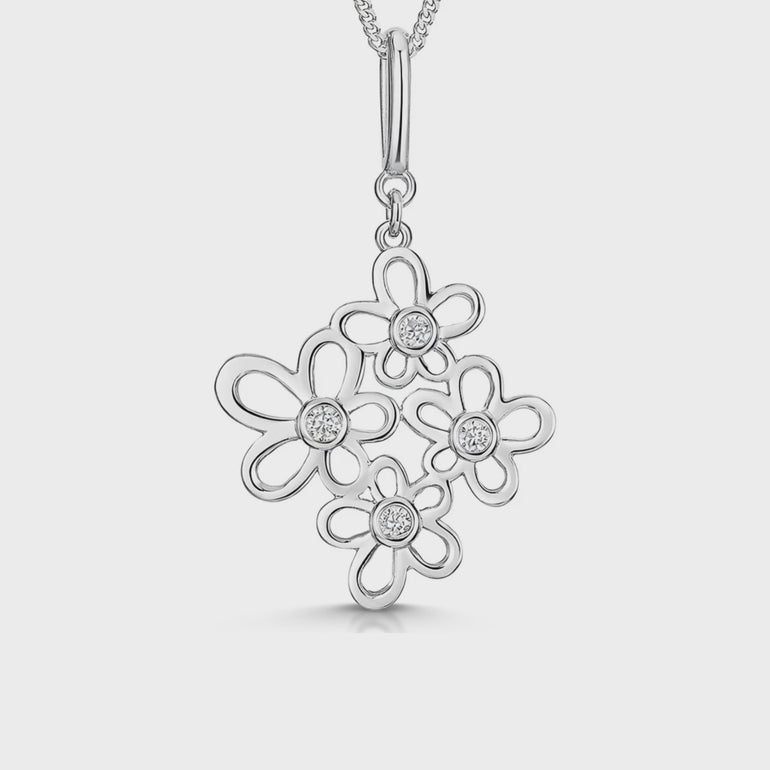 Sterling silver pendant with a graduated multi-flower design set with cubic zirconia centres, on a chain.-JOOLS by Jenny Brown
