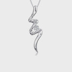 Load and play video in Gallery viewer, A sterling silver flash style pendant with a cubic zirconia stone, attached to a silver chain, with a rhodium finish. - JOOLS by Jenny Brown
