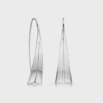 Load and play video in Gallery viewer, A pair of sterling silver sail shape pull through earrings.
