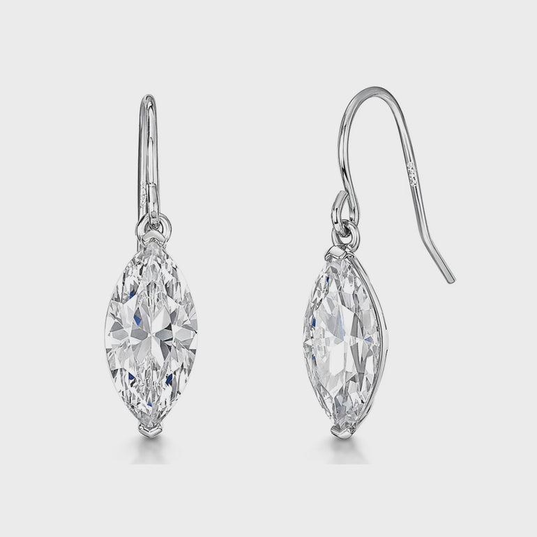 A pair of sterling silver drop earrings with marquise cubic zirconia stones in a two claw setting.