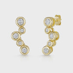 Load and play video in Gallery viewer, A pair of yellow gold bubble drop earrings with five cubic zirconia stones, featuring a series of increasing sizes of stones set in a curved design.
