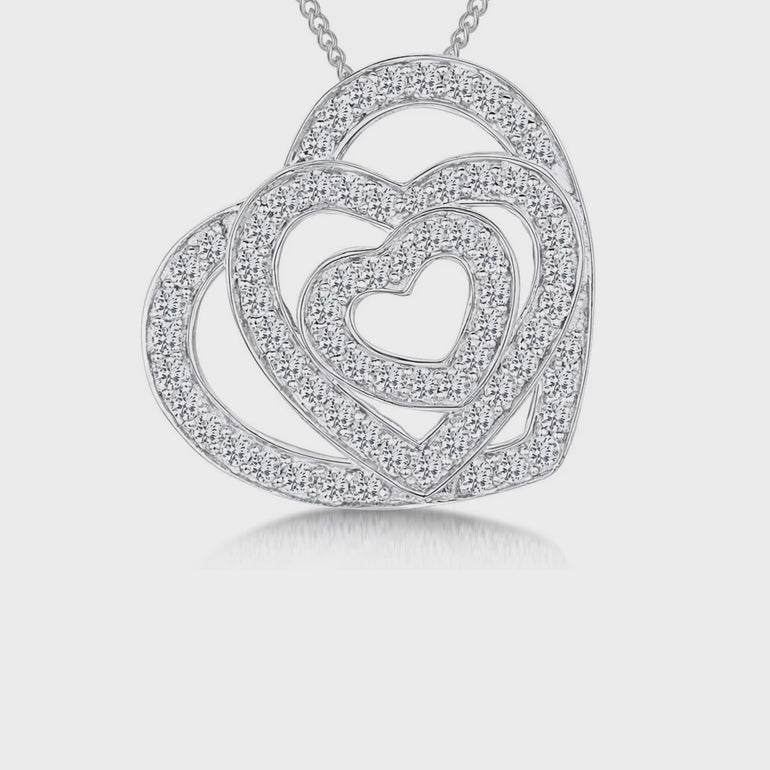 A sterling silver pendant with three interlocking hearts, each studded with cubic zirconia stones - JOOLS By Jenny Brown