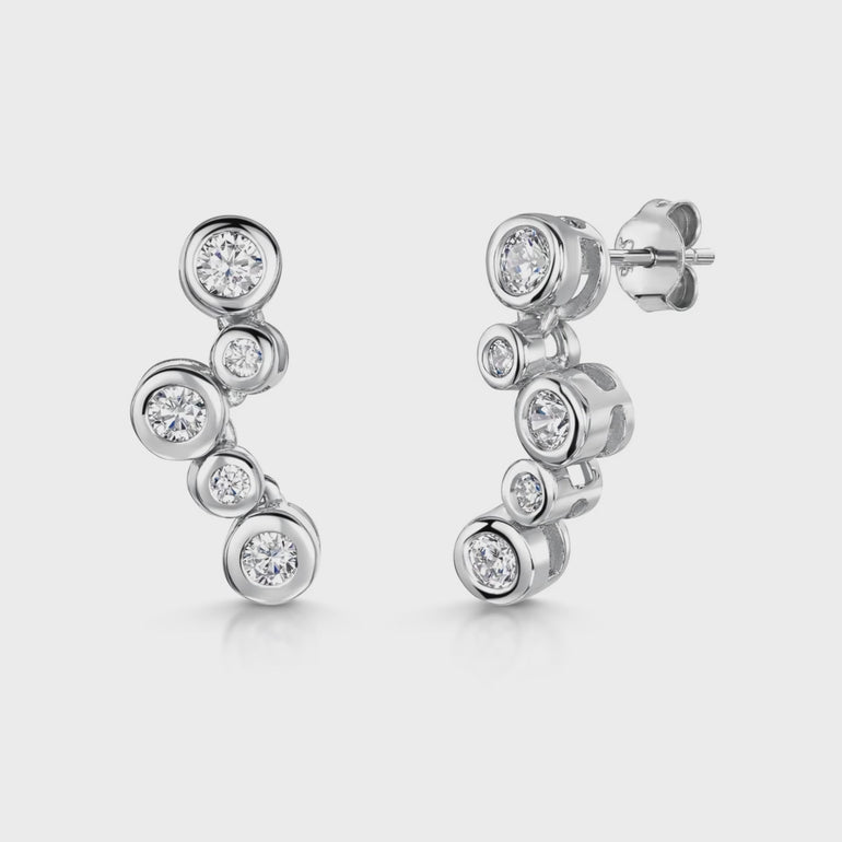 A pair of sterling silver bubble drop earrings with five cubic zirconia stones, featuring a rhodium finish for tarnish resistance.