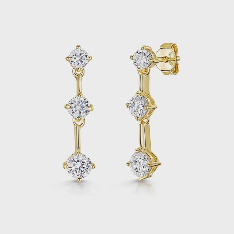 A pair of yellow gold drop earrings featuring three cubic zirconia stones of different sizes-JOOLS by Jenny Brown