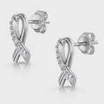 Load and play video in Gallery viewer, A pair of sterling silver ribbon stud earrings with cubic zirconia stones-JOOLS by Jenny Brown

