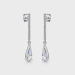Load and play video in Gallery viewer, A pair of sterling silver long pave bar drop earrings with pear cut cubic zirconia stones- JOOLS By Jenny Brown

