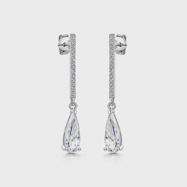 A pair of sterling silver long pave bar drop earrings with pear cut cubic zirconia stones- JOOLS By Jenny Brown