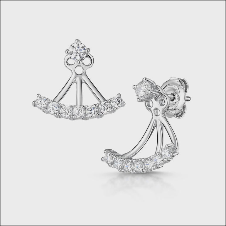 A pair of sterling silver jacket earrings featuring a solitaire cubic zirconia stud and a row of smaller cubic zirconia stones, presented against a white background.

