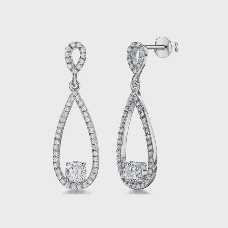 A pair of sterling silver teardrop earrings with a single cubic zirconia stone in the center, surrounded by smaller pave-set cubic zirconia stones.-JOOLS by Jenny Brown