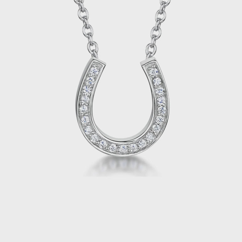 A sterling silver horseshoe pendant necklace with cubic zirconia stones set in a fixed chain-JOOLS by Jenny Brown
