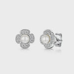 Load and play video in Gallery viewer, elegant stud earrings with central round pearl surrounded by a flower-shaped cluster of small clear stones - JOOLS By Jenny Brown - JOOLS By Jenny Brown
