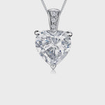 Load and play video in Gallery viewer, A sterling silver pendant with a cubic zirconia heart-shaped stone, mounted on a silver chain. JOOLS By Jenny Brown
