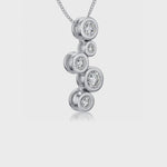 Load and play video in Gallery viewer, A sterling silver pendant featuring five cubic zirconia stones in a graduated bubble design, attached to a silver chain-JOOLS by Jenny Brown
