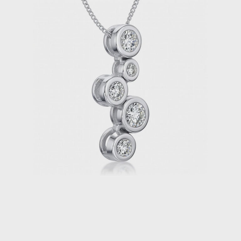 A sterling silver pendant featuring five cubic zirconia stones in a graduated bubble design, attached to a silver chain-JOOLS by Jenny Brown