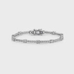 Load and play video in Gallery viewer, Sterling Silver 12.50 Tennis Bracelet Set With half carat and smaller cubic zirconia stones . Snap clasp. JOOLS by Jenny Brown
