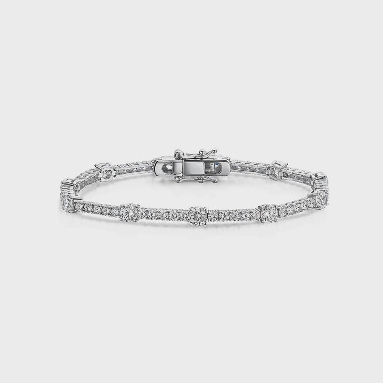 Sterling Silver 12.50 Tennis Bracelet Set With half carat and smaller cubic zirconia stones . Snap clasp. JOOLS by Jenny Brown