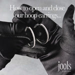 Load and play video in Gallery viewer, Sterling Silver Medium Hoop Earrings
