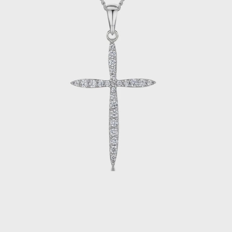 video clip of A sterling silver cross pendant encrusted with round white zirconia stones on a chain-JOOLS by Jenny Brown