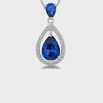 Load and play video in Gallery viewer, Sterling Silver Suspended Sapphire Blue Zirconia Halo Pendant- JOOLS by Jenny Brown
