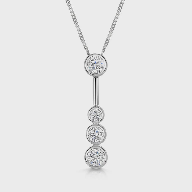 A sterling silver drop bubble pendant with four set cubic zirconia stones, suspended from a chain-JOOLS by Jenny Brown