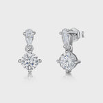 Load and play video in Gallery viewer, A pair of sterling silver teardrop bale earrings with a single cubic zirconia centerpiece set in a teardrop design.
