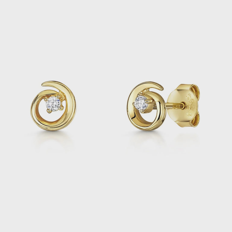 A pair of small yellow gold swirl stud earrings with cubic zirconia in the center-JOOLS by Jenny Brown