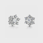 Load and play video in Gallery viewer, A pair of sterling silver snowflake earrings inset with cubic zirconia stones-JOOLS by Jenny Brown
