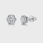 Load and play video in Gallery viewer, Sterling Silver Flower Stud With Central Cubic Zirconia JOOLS by Jenny Brown
