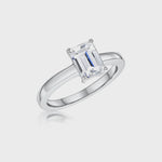 Load and play video in Gallery viewer, STERLING SILVER ONE AND A HALF  CARAT EMERALD CUT SOLITAIRE RINGRings - JOOLS By Jenny Brown
