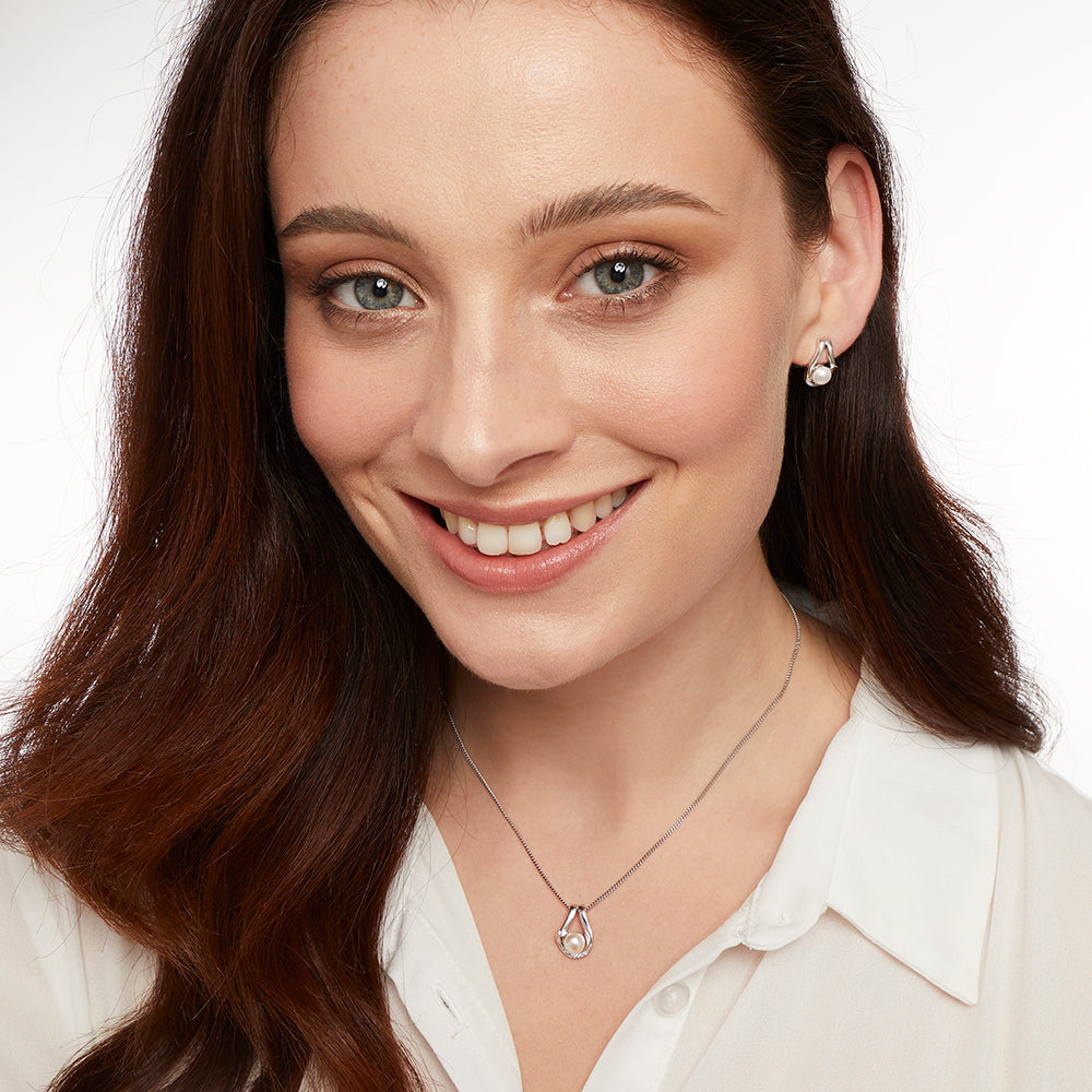 STERLING SILVER AND PEARL EARRINGS IN AN OPEN LOOP SETTING Earrings - JOOLS By Jenny Brown