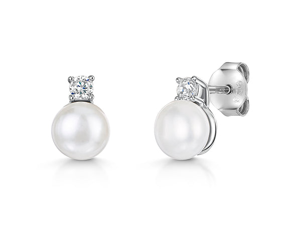 A pair of sterling silver stud earrings featuring a freshwater pearl with a cubic zirconia bale-JOOLS by Jenny Brown