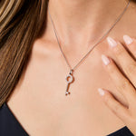 Load image into Gallery viewer, Sterling silver key-shaped pendant with pave set cubic zirconias, attached to a chain.-JOOLS by Jenny Brown
