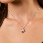 Load image into Gallery viewer, Sterling silver flower pendant with six stone set petals, displayed on a chain-JOOLS by Jenny Brown
