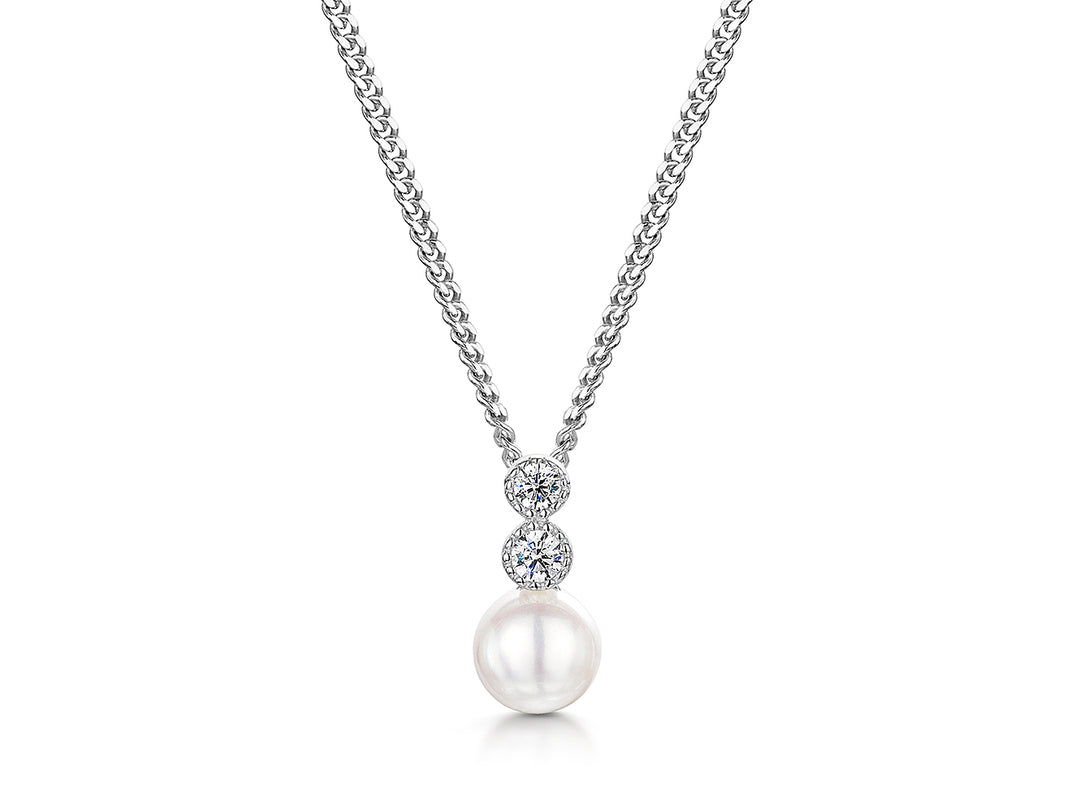 A sterling silver necklace with a freshwater pearl pendant and two white zirconia stones set in a rhodium finished chain-JOOLS by Jenny Brown