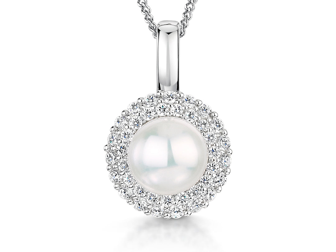 A sterling silver pendant with a central white freshwater pearl surrounded by a halo of cubic zirconia stones, on a silver chain-JOOLS by Jenny Brown