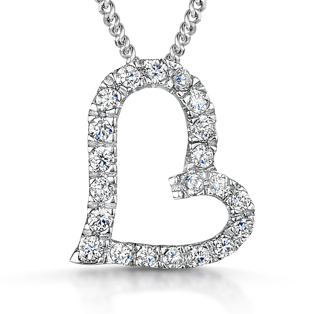 A sterling silver offset pave heart pendant with a cubic zirconia surround, set with small blue stones, on an adjustable chain-JOOLS by Jenny Brown