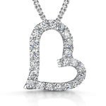 Load image into Gallery viewer, A sterling silver offset pave heart pendant with a cubic zirconia surround, set with small blue stones, on an adjustable chain-JOOLS by Jenny Brown

