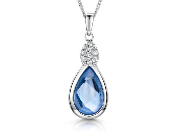 A sterling silver teardrop pendant with blue topaz and cubic zirconia accents, attached to a silver chain-JOOLS by Jenny Brown