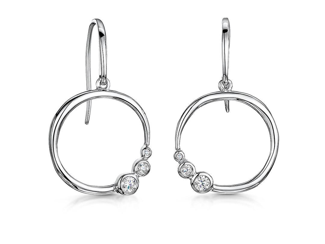 A pair of sterling silver circle earrings with offset  rubover cubic zirconia stones