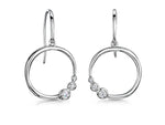 Load image into Gallery viewer, A pair of sterling silver circle earrings with offset  rubover cubic zirconia stones
