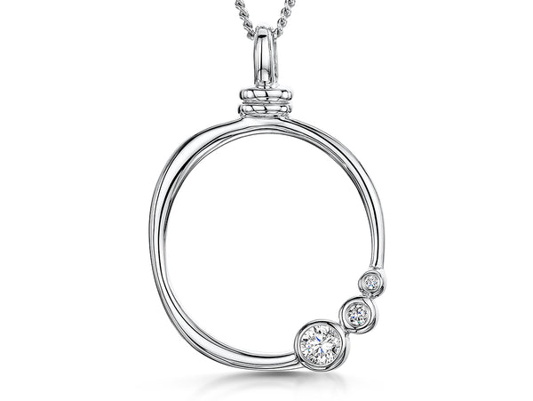 A sterling silver organic circle pendant with three offset graduated cubic zirconia stones, on a silver chain.