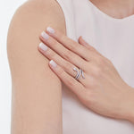 Load image into Gallery viewer, A sleek, silver, snake-inspired ring curves elegantly around the finger, shimmering with rows of sparkling cubic zirconias-JOOLS by Jenny Brown
